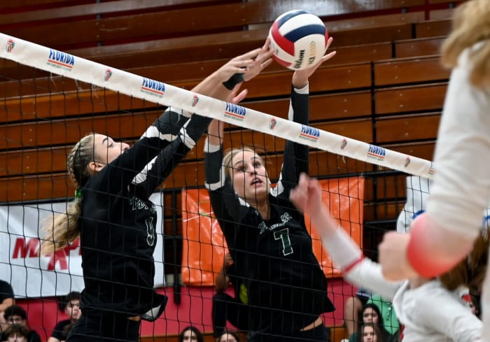 Westminster Christian players Gigi Artiles (7) and Jazmine Nicolas (9) block a Tampa Carrollwood Day shot during the Class 3A state championship match on Thursday at the FHSAA girls volleyball state finals at Polk State College in Winter Haven.